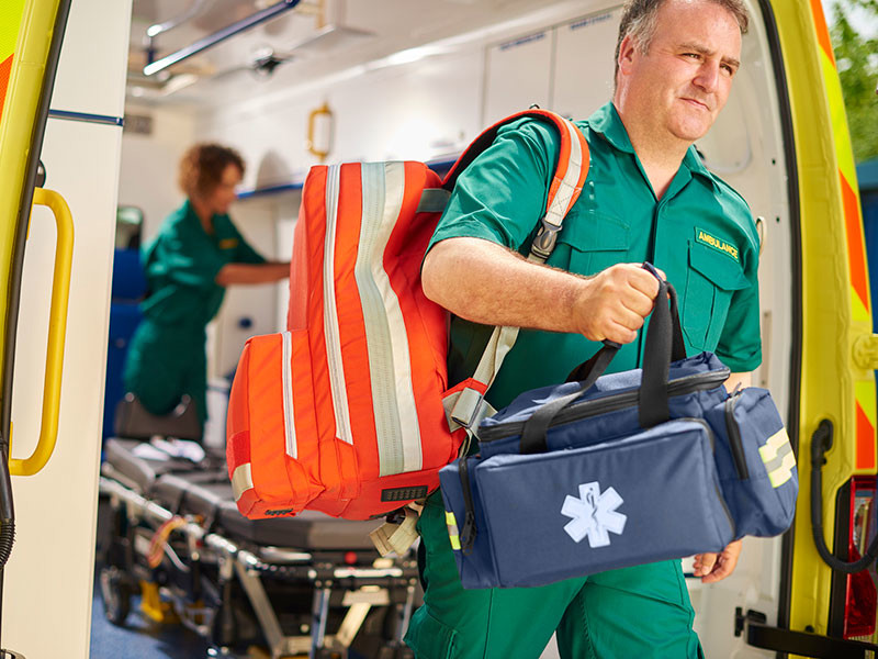 Paramedic exiting ambulance
